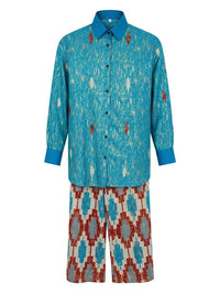 Patterned shirt and pants set on a white background. Traditional Wear