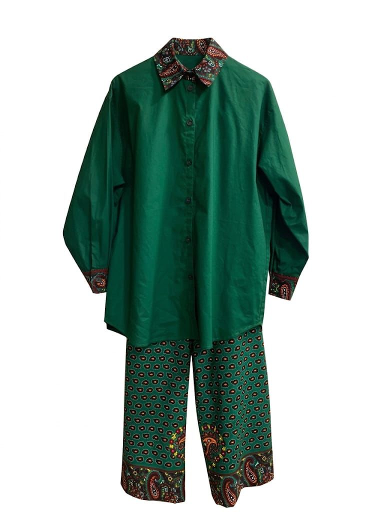Green traditional outfit with patterned collar and pants on a white background